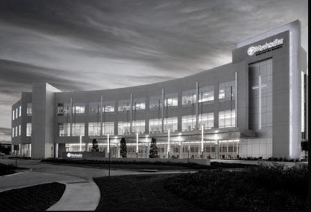 A building with many windows and lights on it